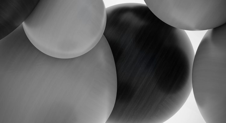 Abstract grayscale close-up of overlapping smooth, rounded shapes with brushed-metal texture.