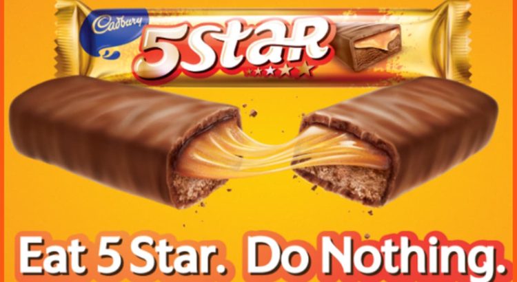 Cadbury 5 Star chocolate bar with caramel filling, split in half on an orange background with the slogan 'Eat 5 Star. Do Nothing.'
