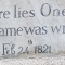 Stone gravestone with the epitaph 'Here lies One Whose Name was writ in Water.' and the date 'Feb 24 1821' carved into it.